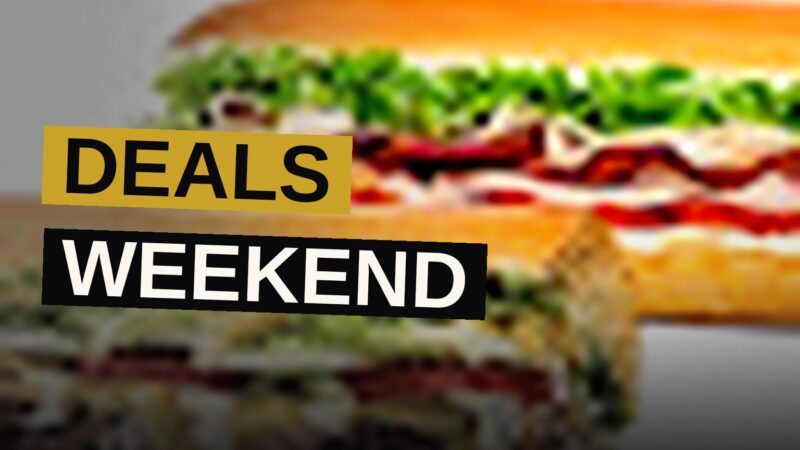 A picnic table piled with fast-food favorites like fried chicken, donuts, and sliders for Labor Day weekend.
