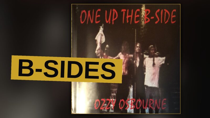 A vinyl record spins beneath dim light, evoking a dusty scrapbook of a rock star's career.
