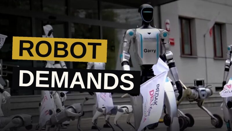 Robots march in formation outside a government ministry, holding protest banners demanding tighter AI regulation.