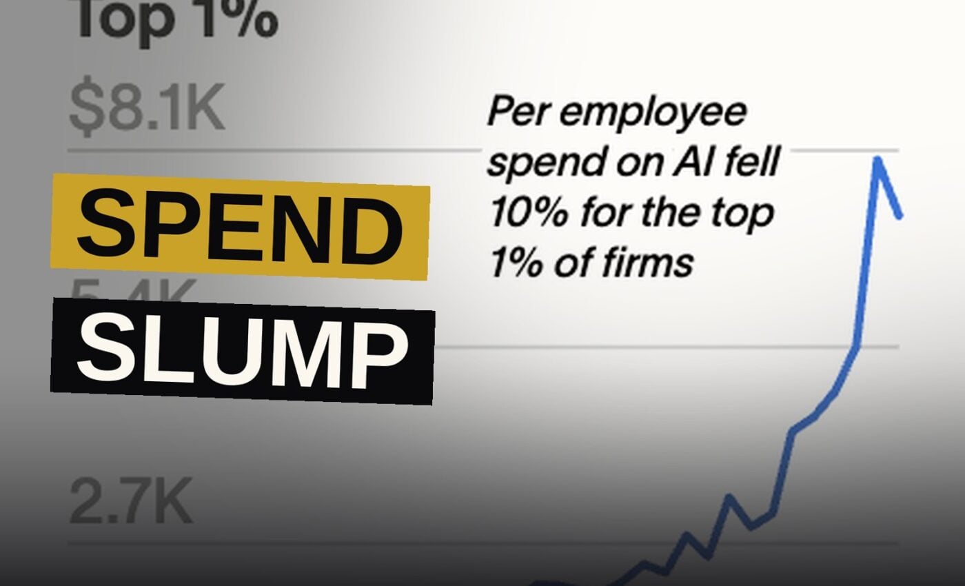 A downward-trending chart glows on a screen in an empty modern office, symbolizing slowing AI spending.