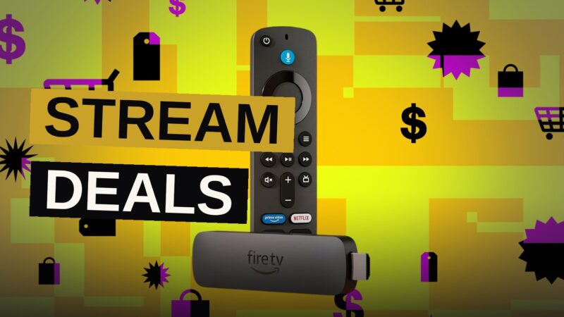 A Fire TV Stick 4K remote and streaming device on a table in front of a television displaying a colorful movie scene.