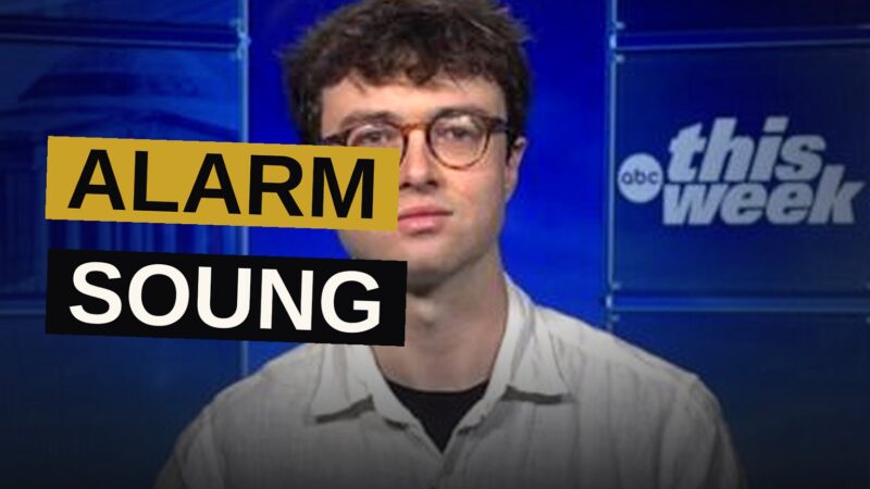 A researcher raises a hand in warning near a glowing server farm, symbolizing a dire technological warning.