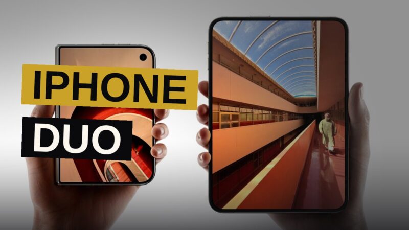 A foldable smartphone stands slightly open on a dark reflective surface under studio lighting.