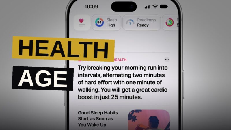 A person checks health metrics glowing on their smartwatch screen in soft morning light.