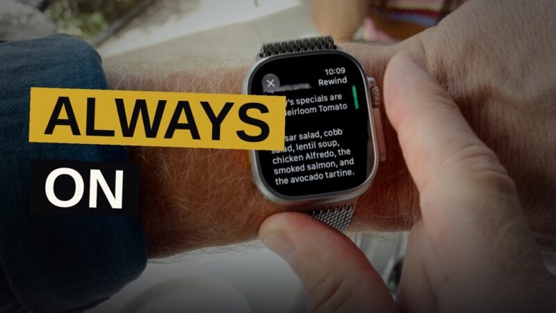 A person wearing a smartwatch in a cafe, with a glowing microphone symbol on the watch face, as other patrons chat in the background.