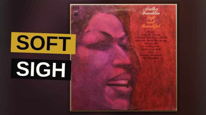 A soul singer stands in warm amber light, eyes closed, evoking a soft, melancholic mood.