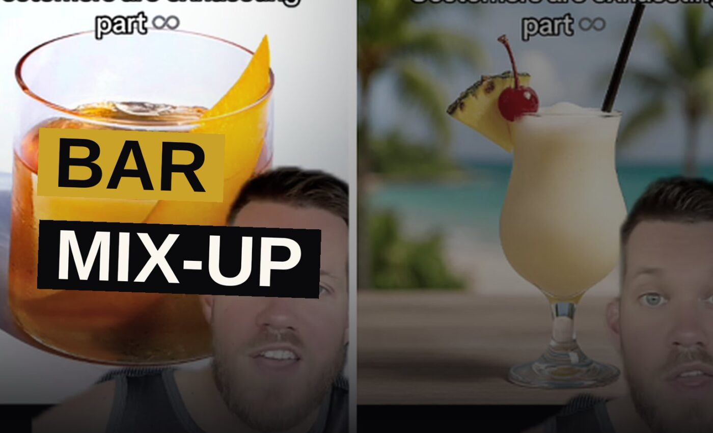 An Old Fashioned and a Piña Colada sit side by side on a bar counter, showing their contrasting colors and vessels.