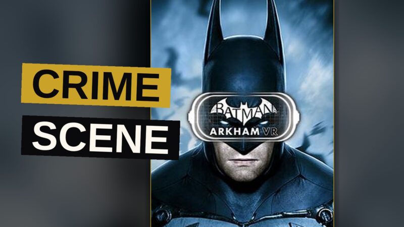 Bruce Wayne stands amid a dimly lit Gotham street, rain falling upon the pavement below.