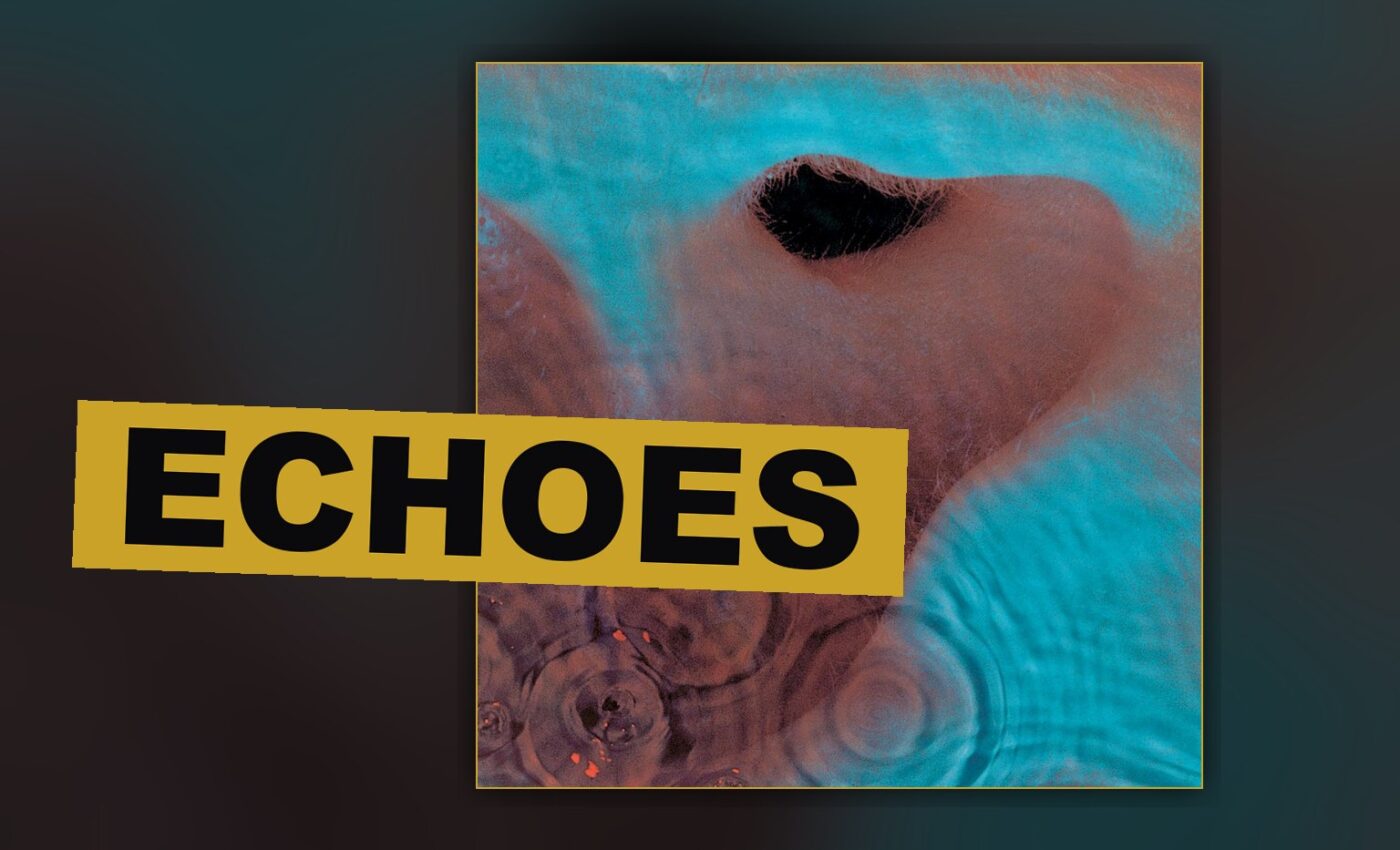 A record turns beneath low light, its surface suggesting the long, drifting song that fills an entire side.
