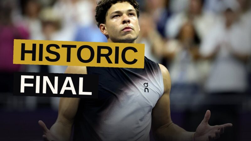 Ben Shelton raises his arms in triumph after defeating Frances Tiafoe at the US Open.