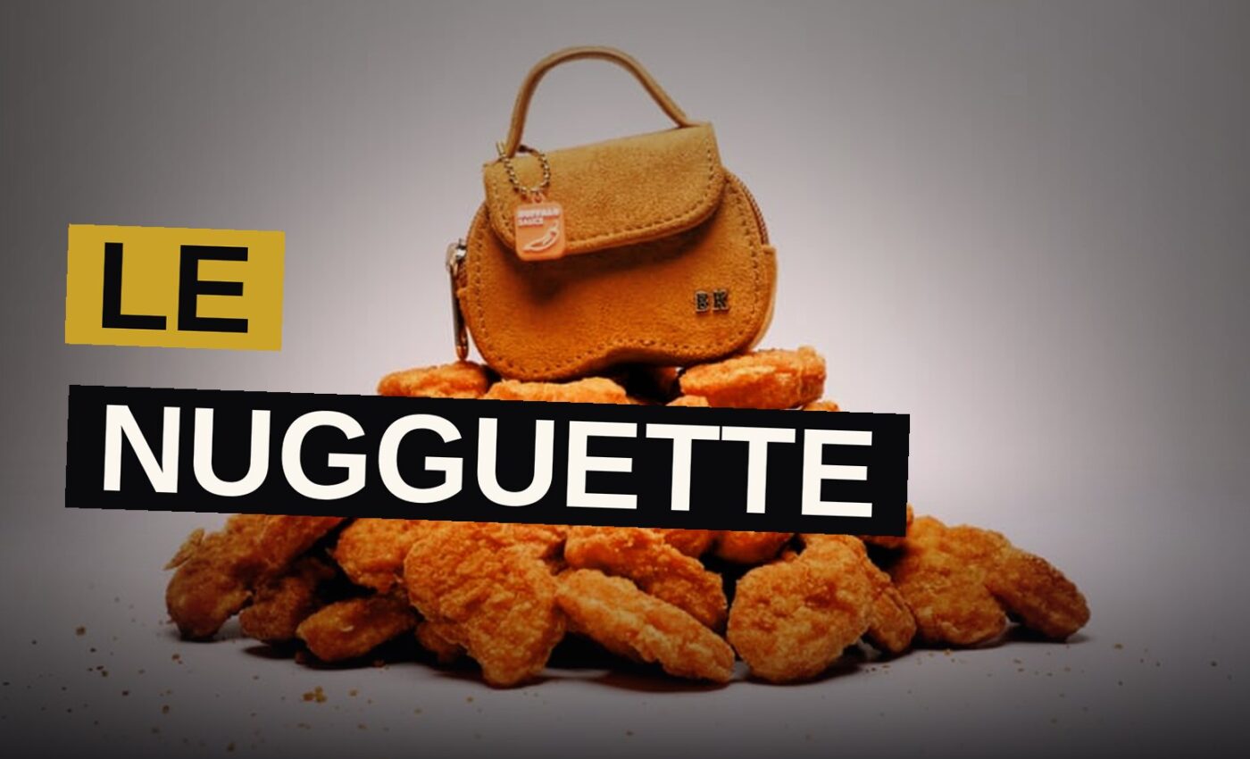 A small bag shaped like a chicken nugget with gold charms beside it.