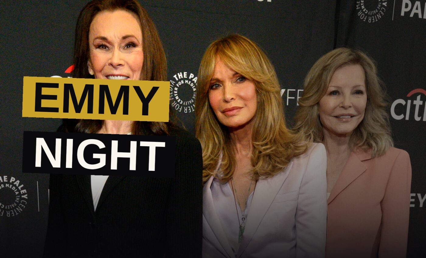 A shimmering Emmy statuette on a red carpet under bright lights at an awards ceremony.