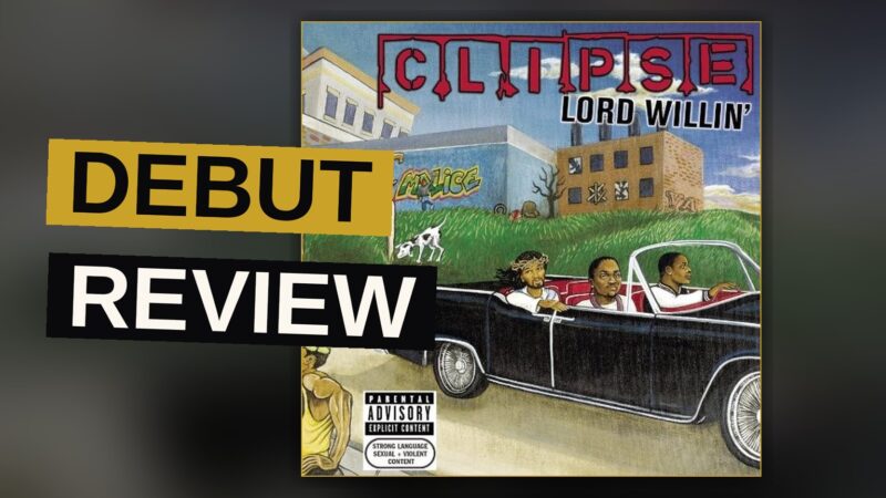 Two hip-hop artists stand together in a dim studio, evoking the mood of a debut album.