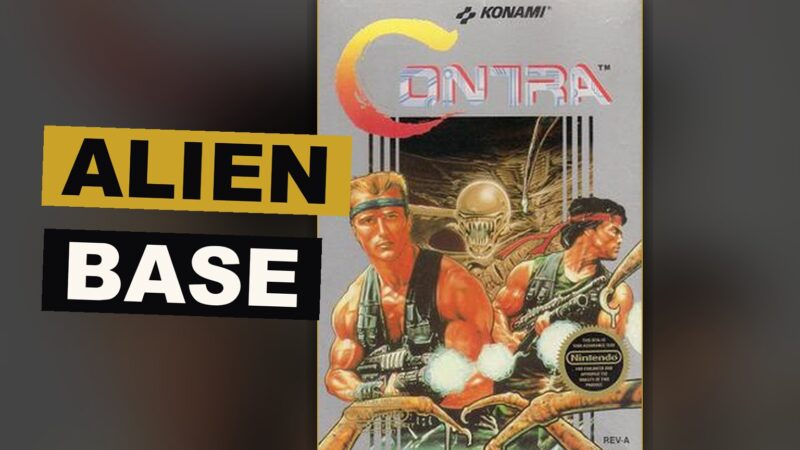 Two soldiers armed with guns storm through thick forest ground against an alien force.