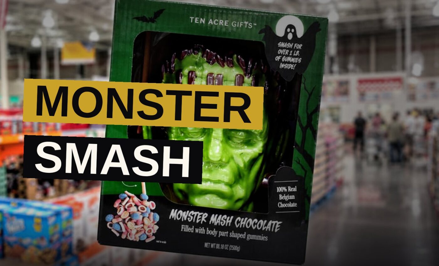 A cracked-open chocolate Frankenstein head with gummy body parts spilling out, next to a wooden mallet.