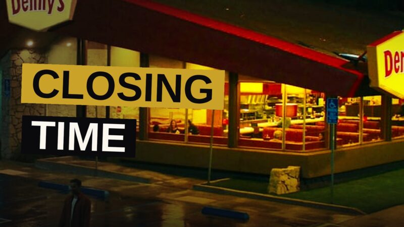 A Denny's restaurant with a dark sign and empty parking lot, a closure notice on the door.