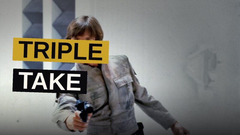 Three heroes of the Star Wars saga stand together in dramatic silhouette.
