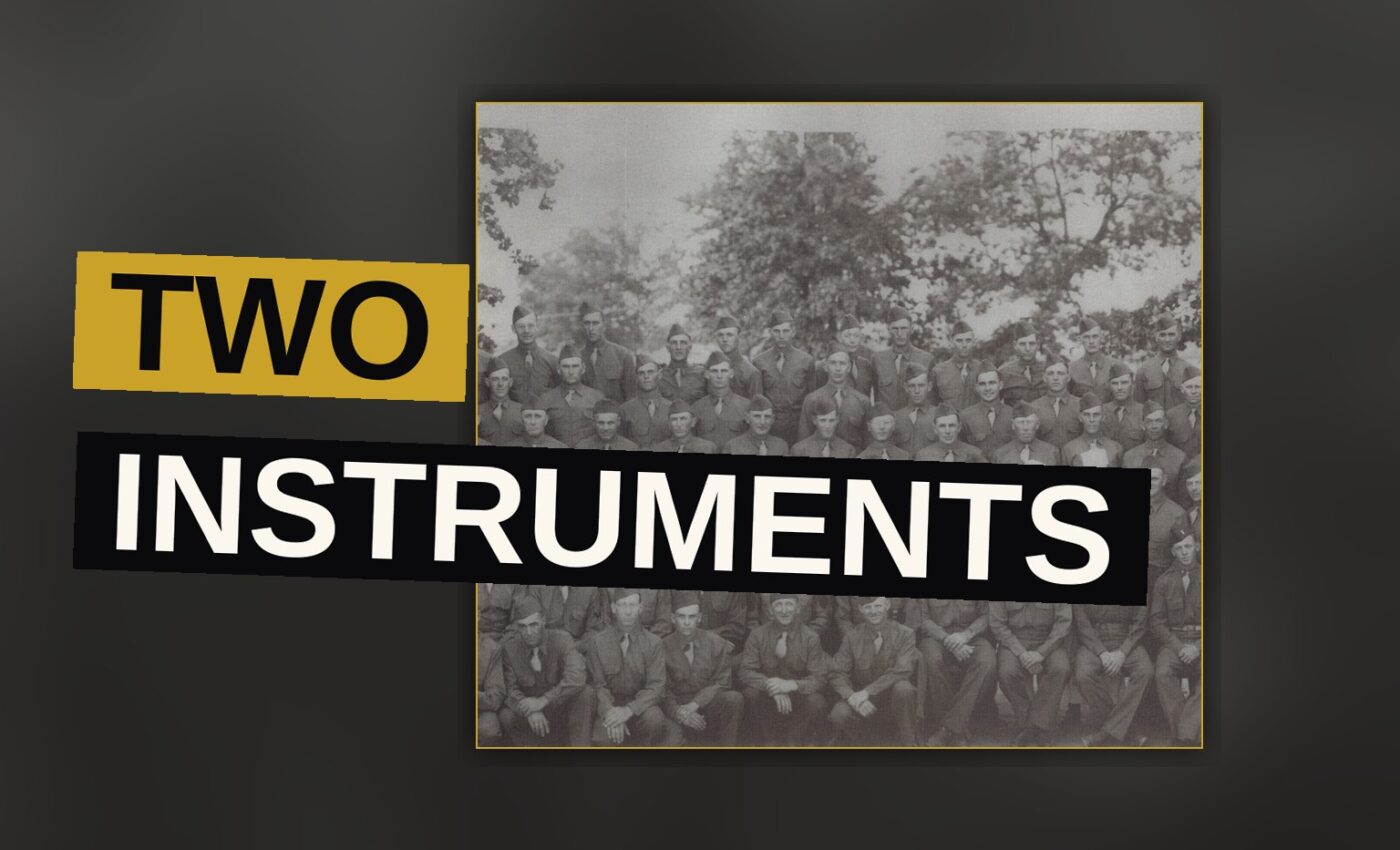 A guitar and drums sit together under dim red light, evoking the heavy, atmospheric sound of the record.
