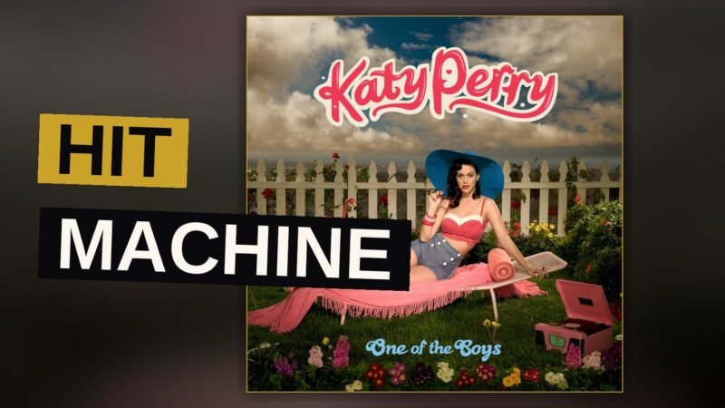 A pop star stands amid neon lights and falling confetti, evoking the energy of a hit-making record.