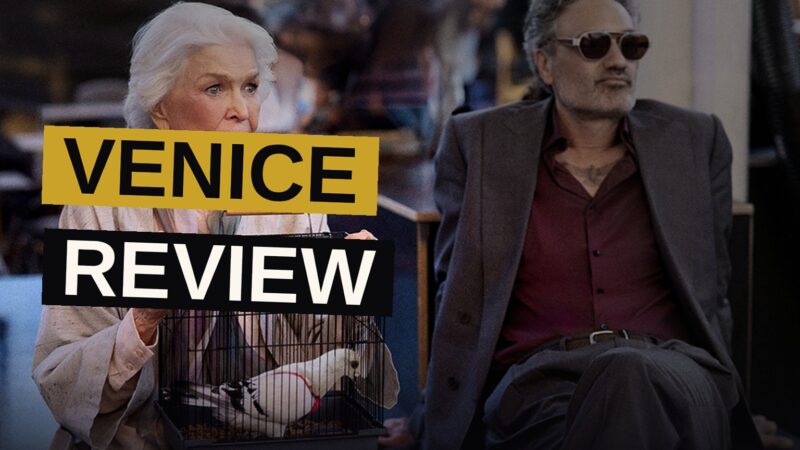 Ellen Burstyn and Taika Waititi sit in a car with a white pigeon on the dashboard during golden hour.