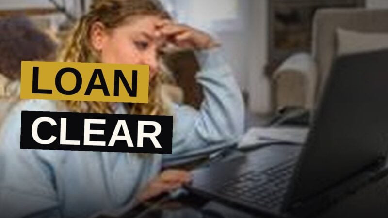 A student reviews loan documents on a desk while considering future financial obligations.