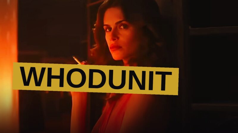 A terrified young woman in a dark bedroom, with a masked figure looming behind her.