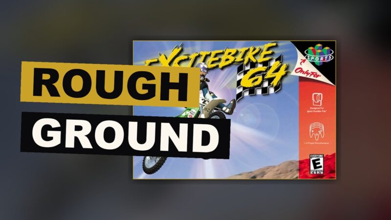 A rider bends into a turn on rough, packed earth, catching air as the machine strains under real force.