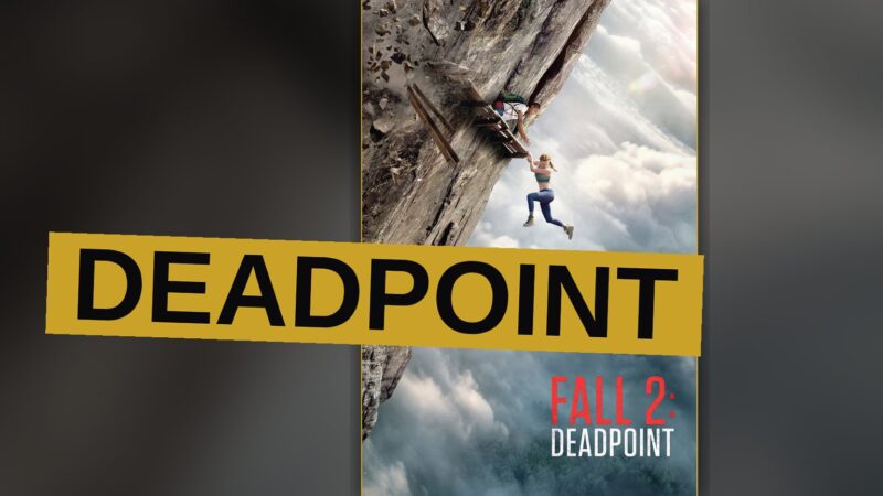 A climber clings to a towering wall of rock, the earth falling away beneath in dizzying descent.