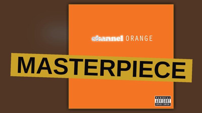 A man stands alone in a dim room bathed in orange light, evoking the album's introspective and melancholic mood.