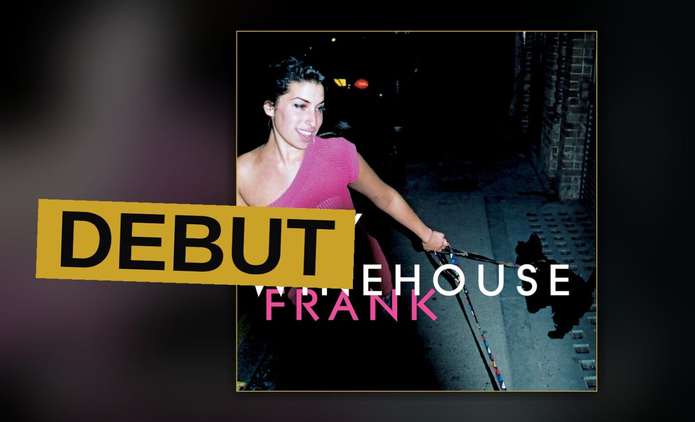 A young singer stands under dim light with a microphone, evoking the soulful mood of her debut album.