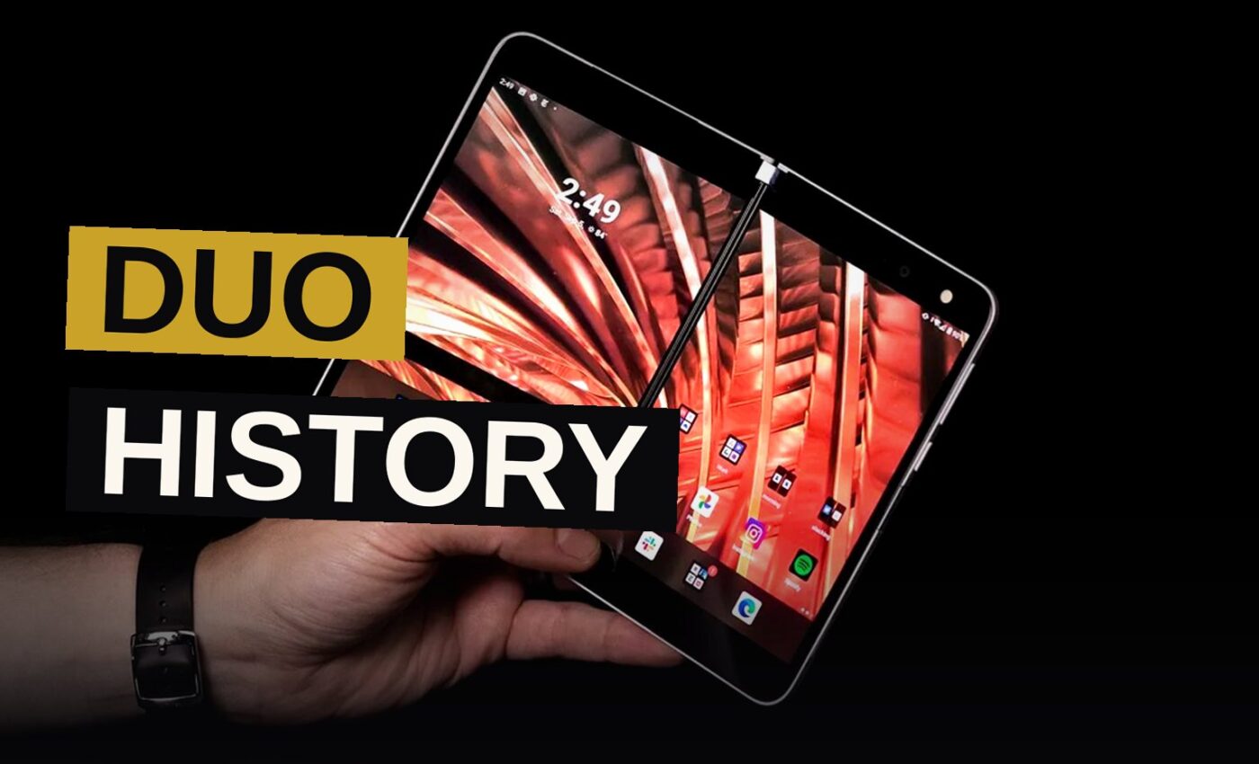 A modern foldable smartphone with a subtle screen crease sits next to a shadowy display of older Duo-branded devices.