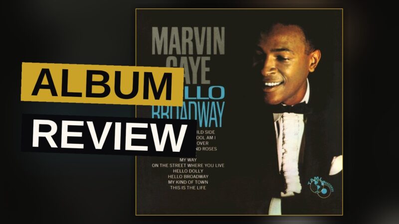 Illustration of Marvin Gaye in a suit on a Broadway street at night, with glowing marquee lights in the background.