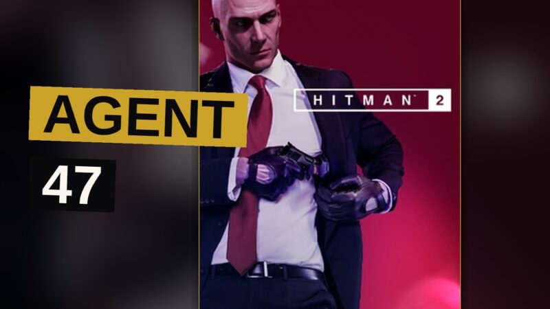 Agent 47 moves through a bustling Mumbai street, disguised among the crowd.