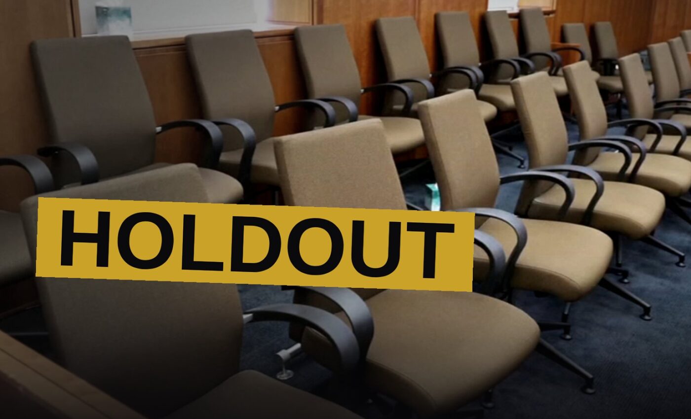 An empty jury box sits within a solemn chamber, the scene heavy with doubt and sorrow.