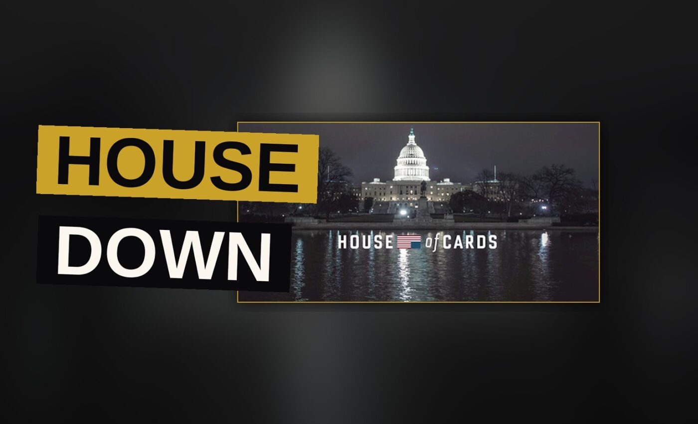 A dark-suited man stands before a shadowy Washington backdrop in a tense political scene.