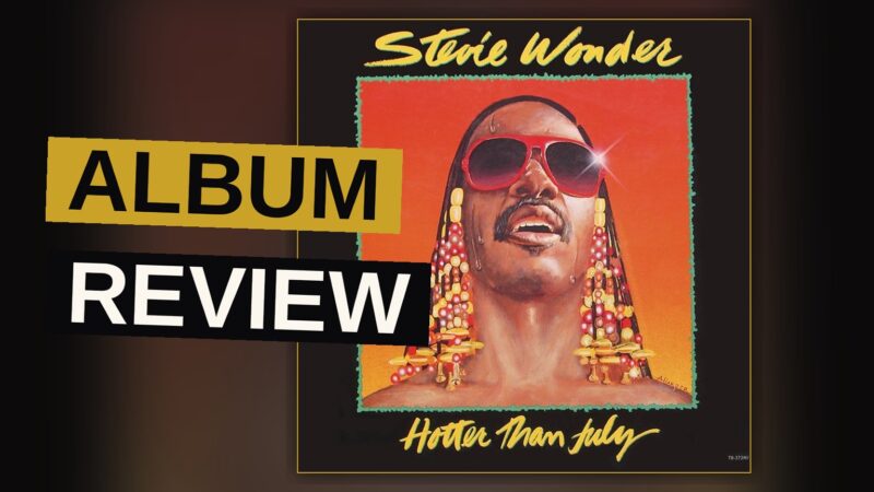 A joyful Black musician in sunglasses and braids bathed in warm summer light, evoking a classic 1980s soul album cover.
