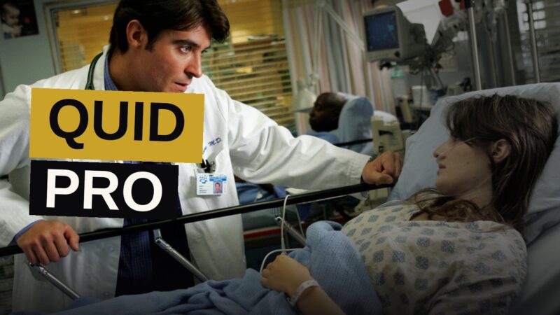 A doctor rushes through a dimly lit hospital corridor toward a patient's room.