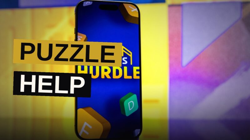 A smartphone screen showing a colorful word puzzle game with letter tiles in green and yellow.
