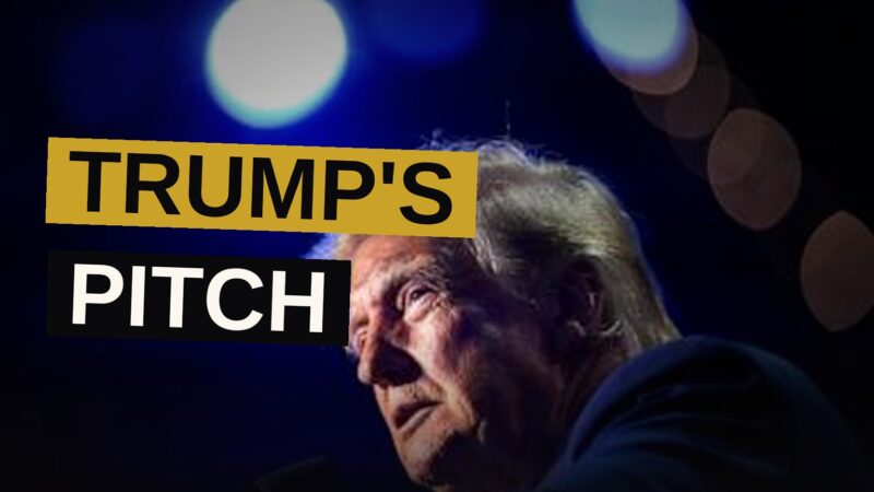 President Donald Trump speaks at a microphone during the GOP midterm convention in Dallas, with a large crowd and American flags behind him.