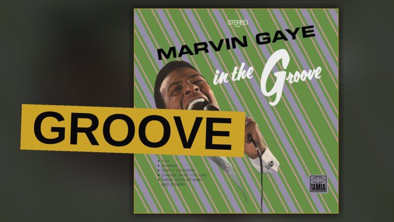 A classic vinyl record sleeve for Marvin Gaye's 'In the Groove' album, partially open with the record visible, in warm lighting.