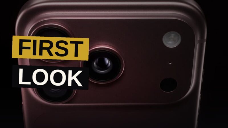 A burgundy iPhone 18 Pro Max showing its upgraded triple camera system against a dark background.