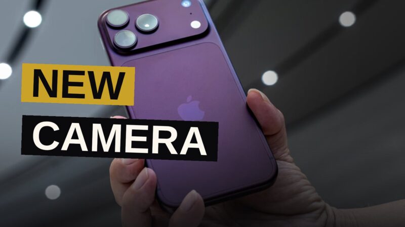 A smartphone camera lens showing adjustable aperture blades in a dark room.
