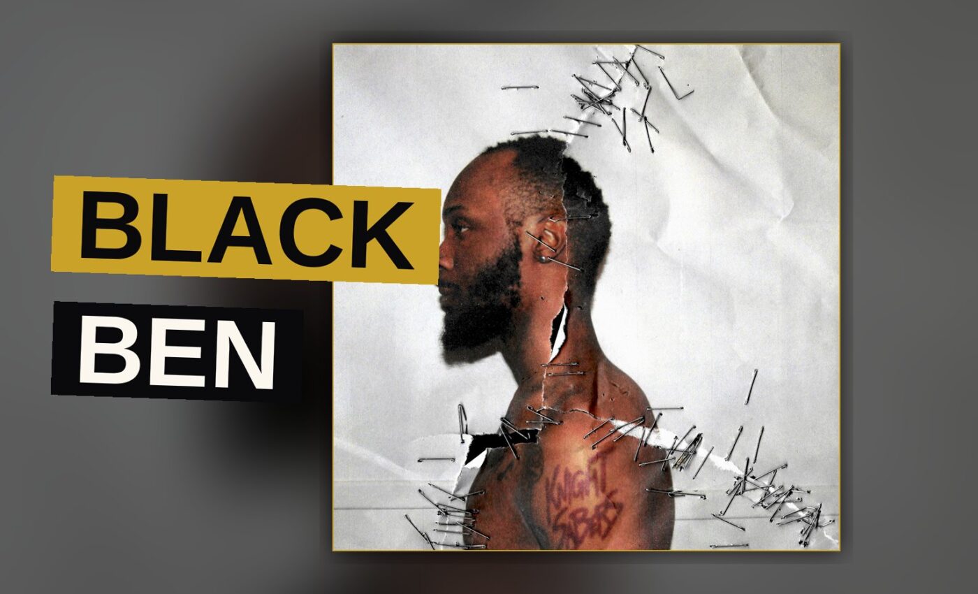 A rapper stands amid neon light and scattered electronics, conveying raw creative intensity.