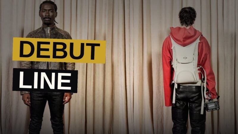 A luxury backpack designed for streamers sits on a runway, combining broadcasting gear with high-end fashion styling.