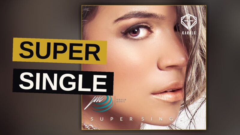 A pop star performs energetically under bright stage lights.