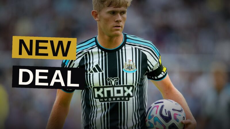 Lewis Hall signs a contract at Newcastle United's St James' Park.