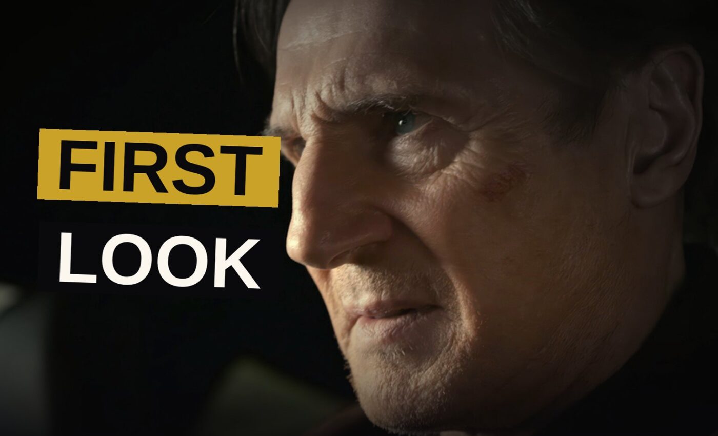 Liam Neeson stands confidently in front of a sleek car as police cars and a helicopter pursue him in the background.