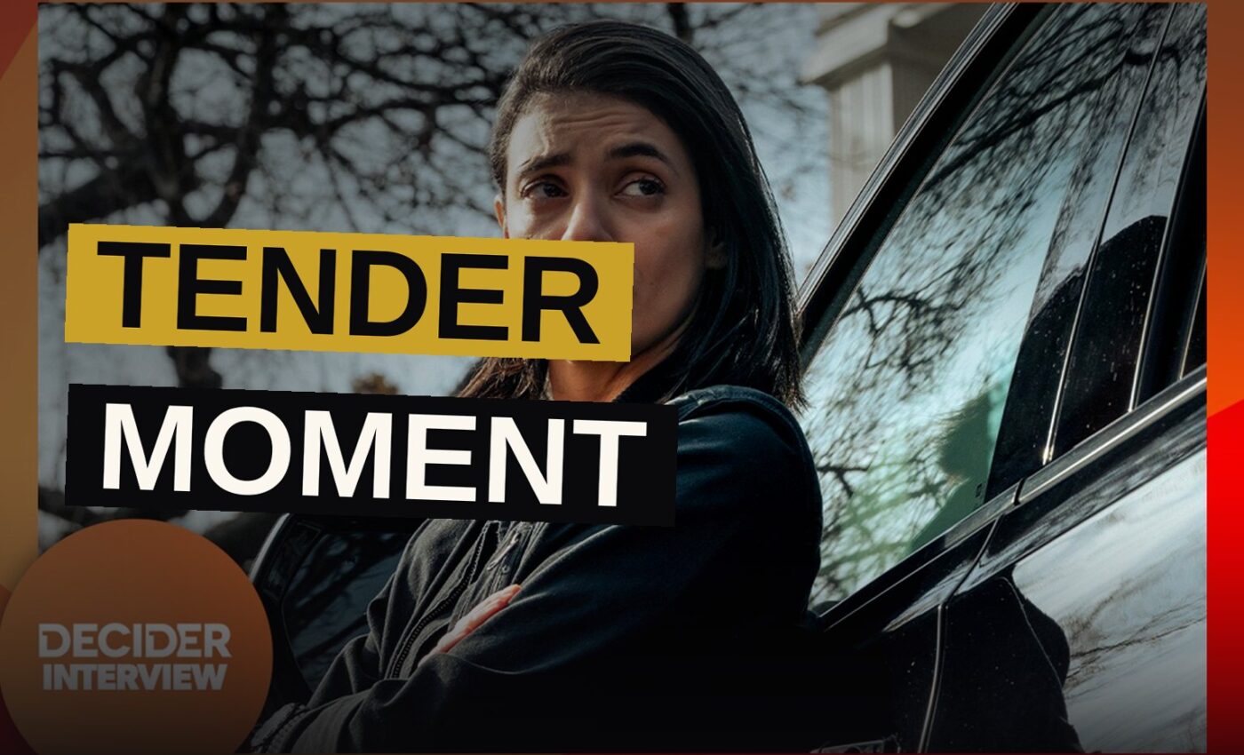 A lioness character embraces her partner inside a helicopter, conveying warmth amid a tense situation.
