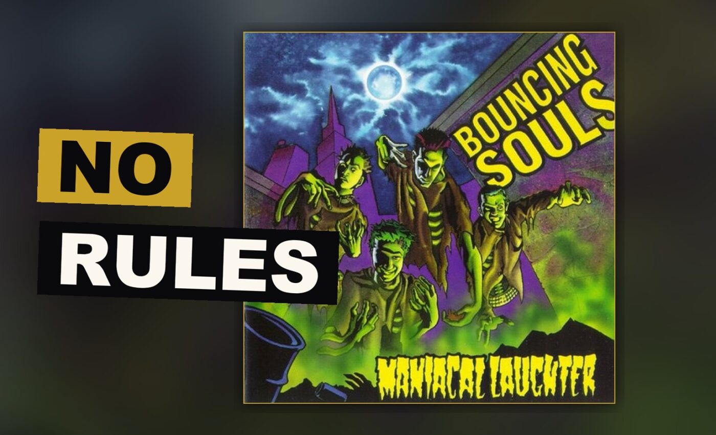 A young punk band gathers together in a dim garage, instruments raised, caught mid song.