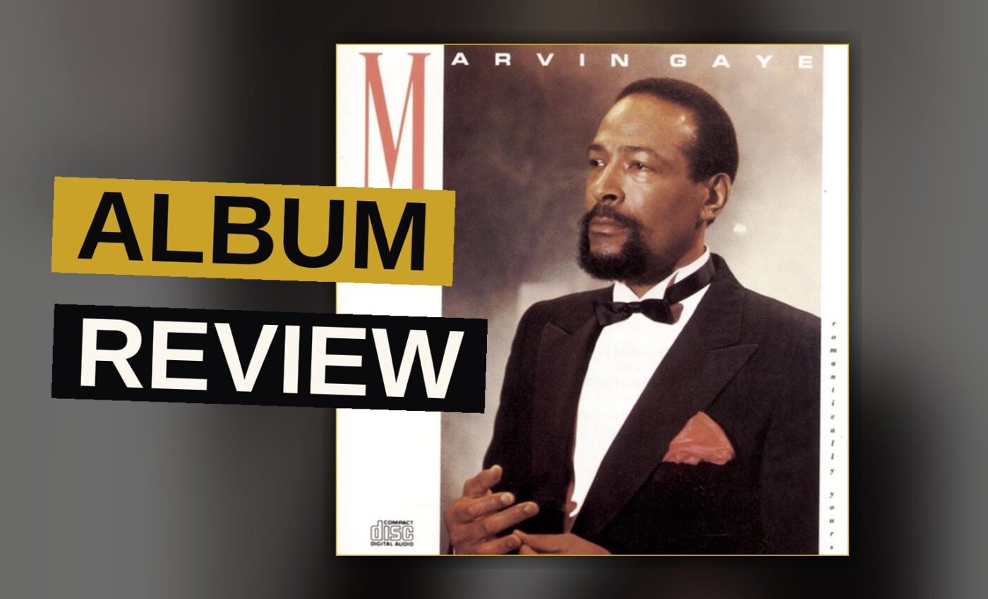 A classic vinyl record sleeve on a wooden table, with warm lighting and a blurred orchestra.